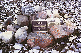 Stone burial cairn with plaque